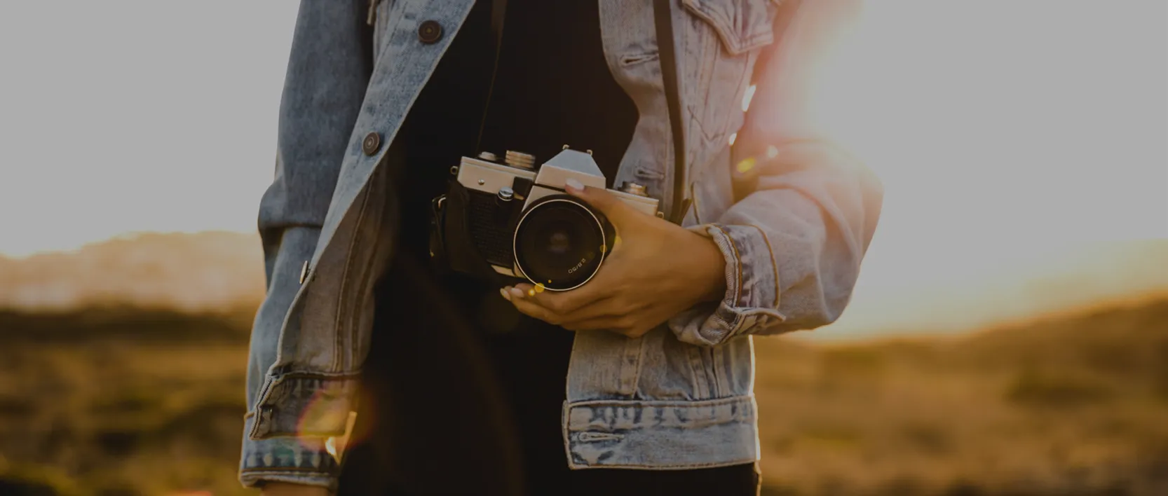 Highway West Vacations Press page banner, lady holding a camera.